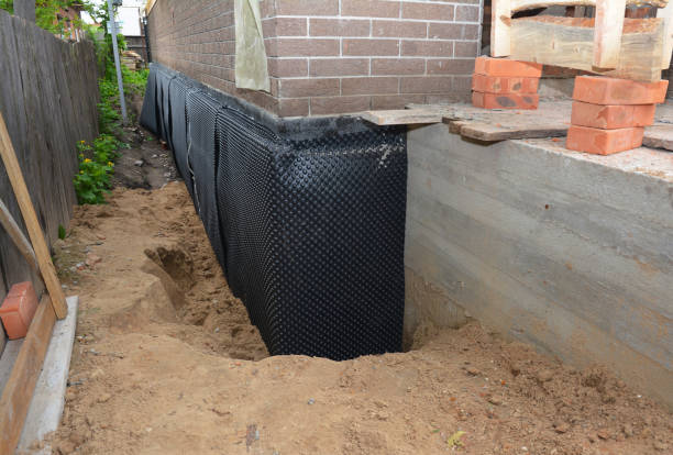 Happy homeowners after waterproofing job in Sullivan